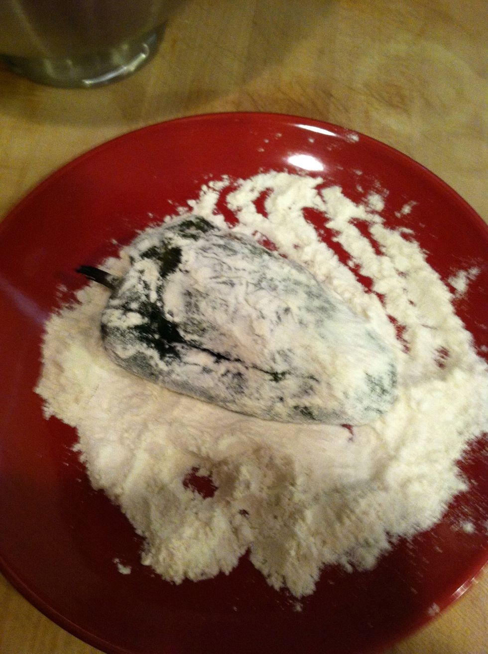 I just do it with my hand to cover with flour