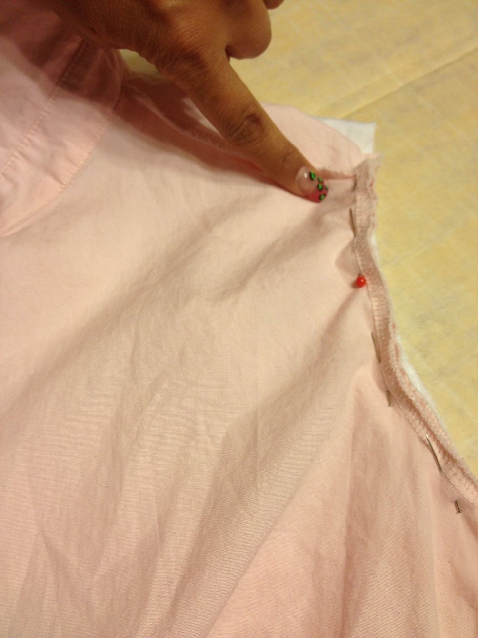 I JUST realized I forgot a picture. Oops! After pinning collars. You firmly tuck the pink sleeve in & as best as you can pull the seam out & pin it via along seams. Then trace it.