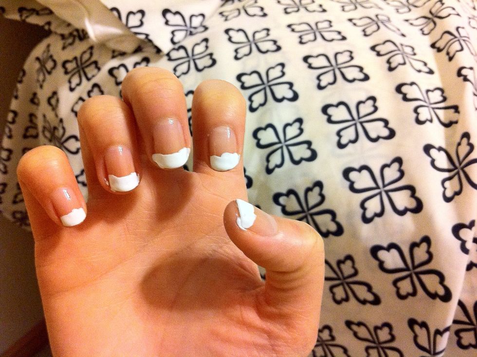 I just use the white nail polish and brush it on my tips.