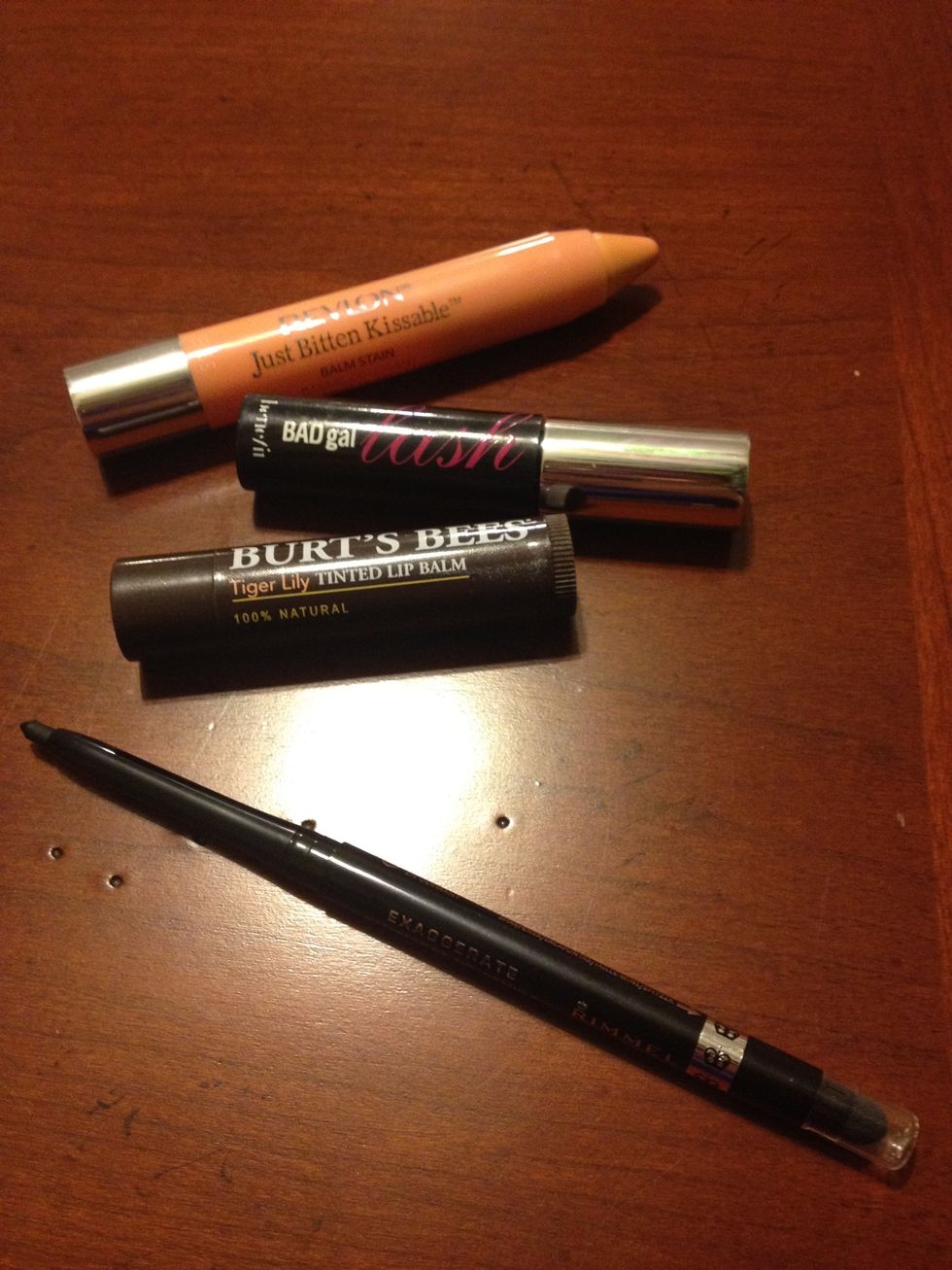 I keep a black eyeliner and a mini tube of my favorite mascara to keep my eyes looking wide awake. I also keep a tinted lip balm for double duty use and a lip crayon for a natural looking pout. \ud83d\udc8b