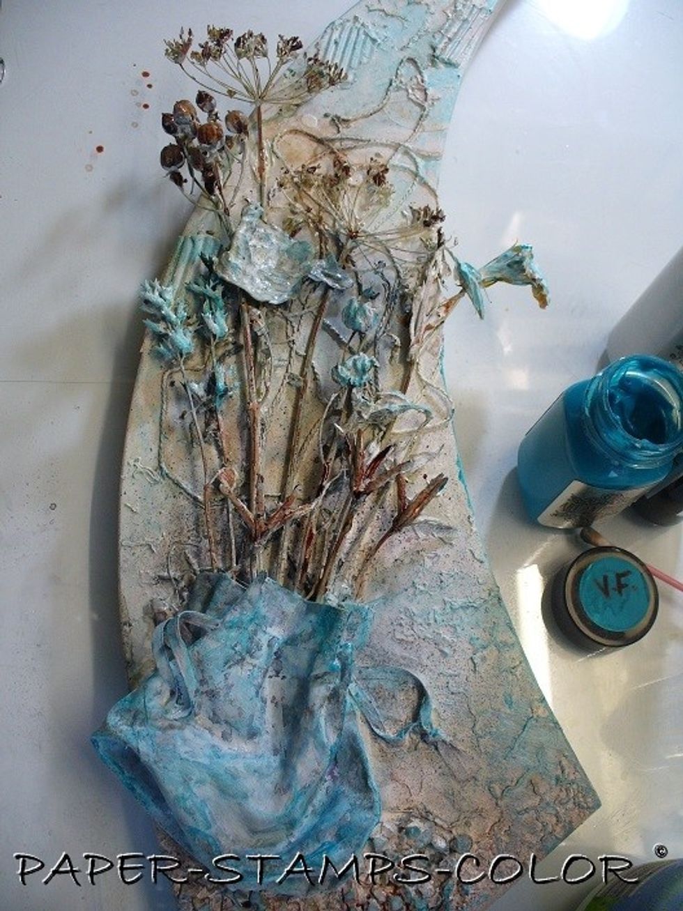 I kept going! I also colored the flowers with it. I toned the blue down by dabbing some white paint over it with my finger. I also added some blue to the background, rubbing it on with my finger.