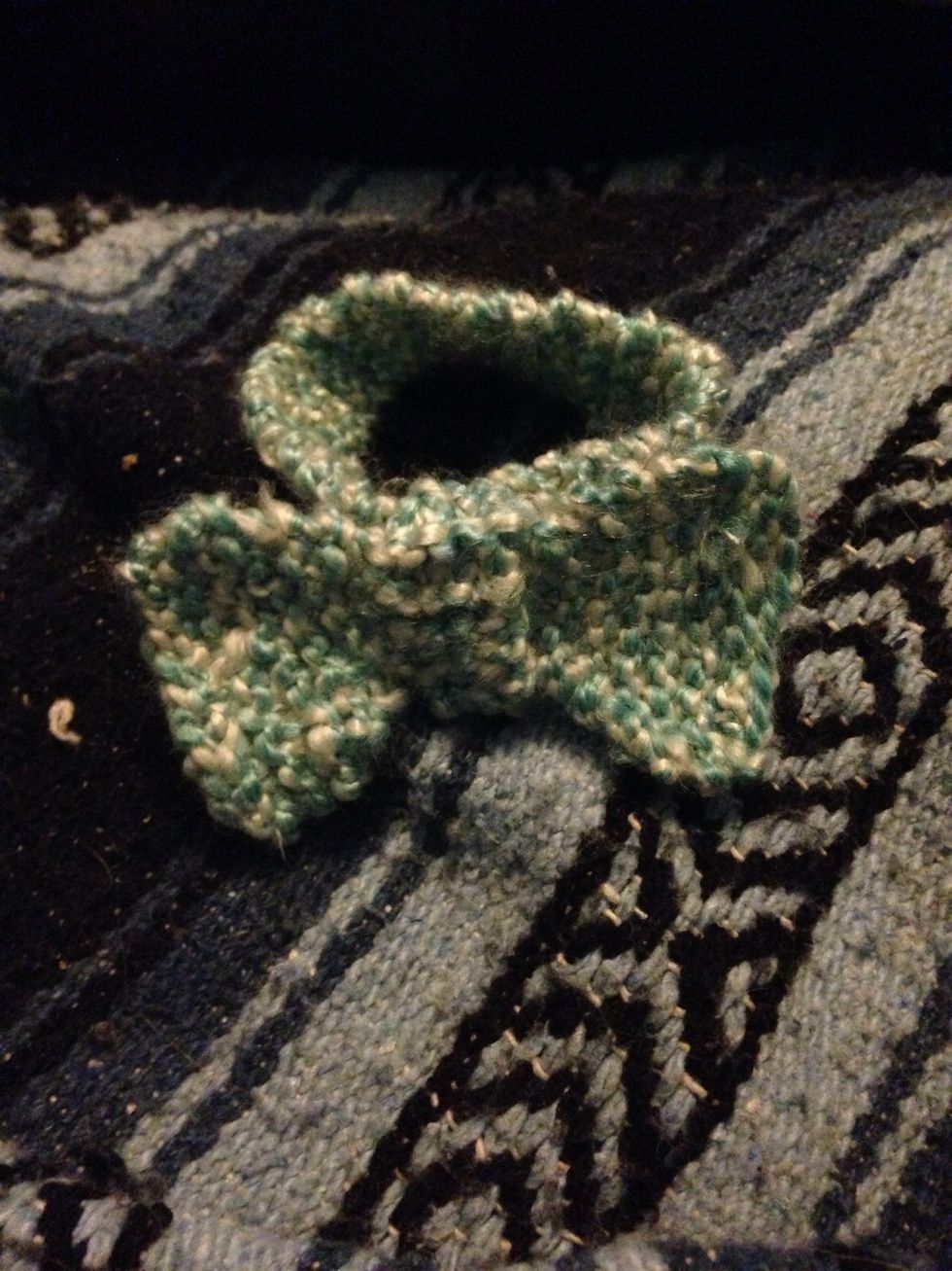 I knit a small loop and sewed It to make it look more like a bow tie