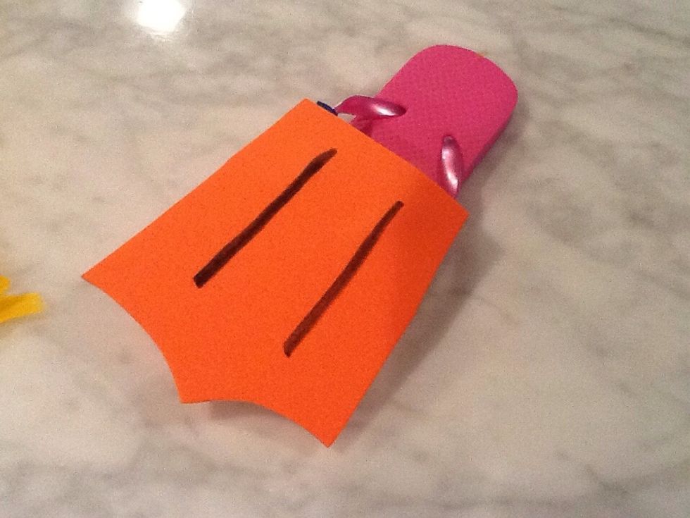 I learned that you have to wrap the straps of the flip flops with ribbon in order for the foam to be hot glued and stay. Didn't work without being wrapped.