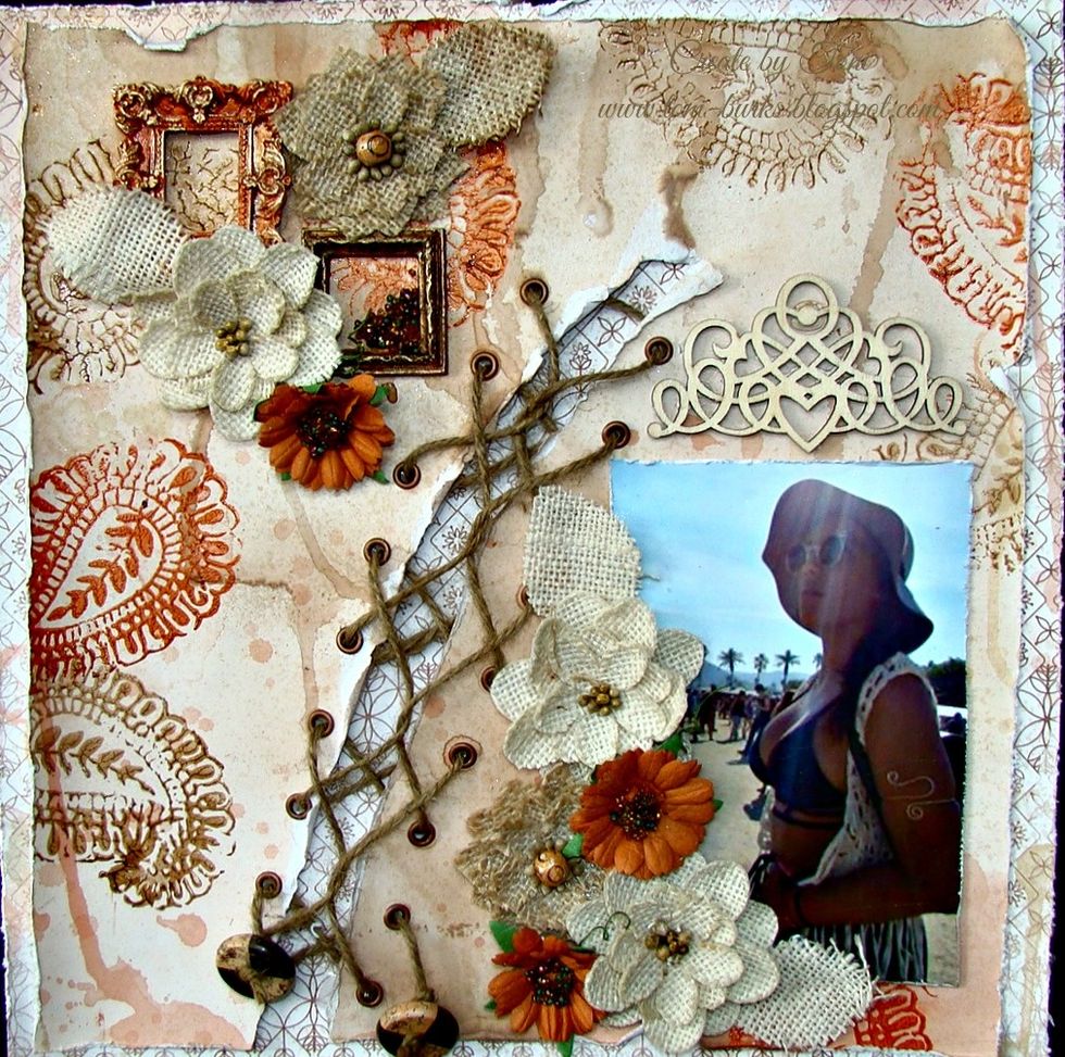 I left the wood piece above my photo natural and applied to layout using adhesive. Add all your frames and flowers.