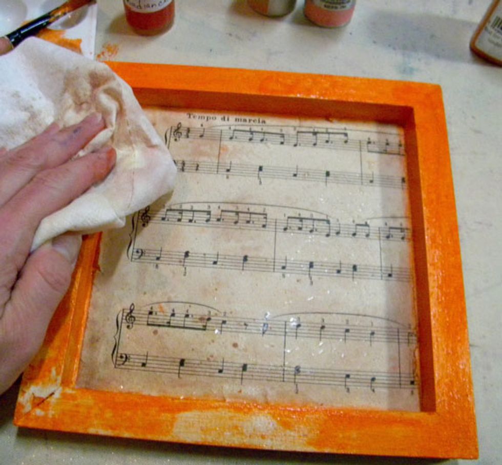I let the water sit there for a minute or so, then dabbed it with a towel. The water removed some of the paint and ink.