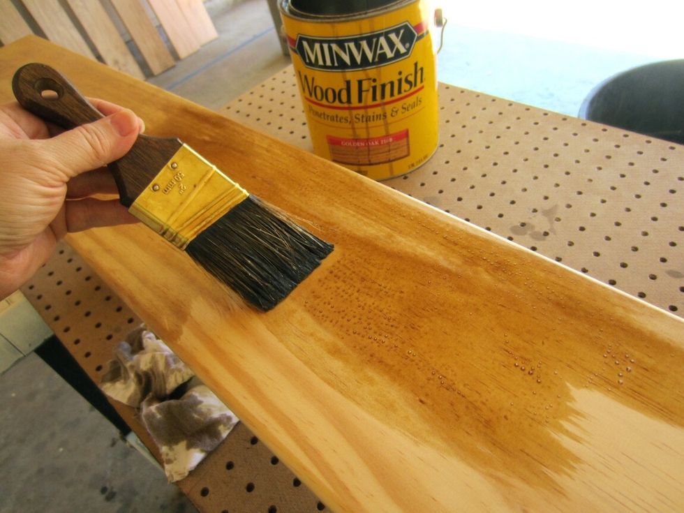 I like the look of Golden Oak by Minwax. Allow 72 hours to dry so that the stain is completely absorbed into the wood and won't repel the vinyl.
