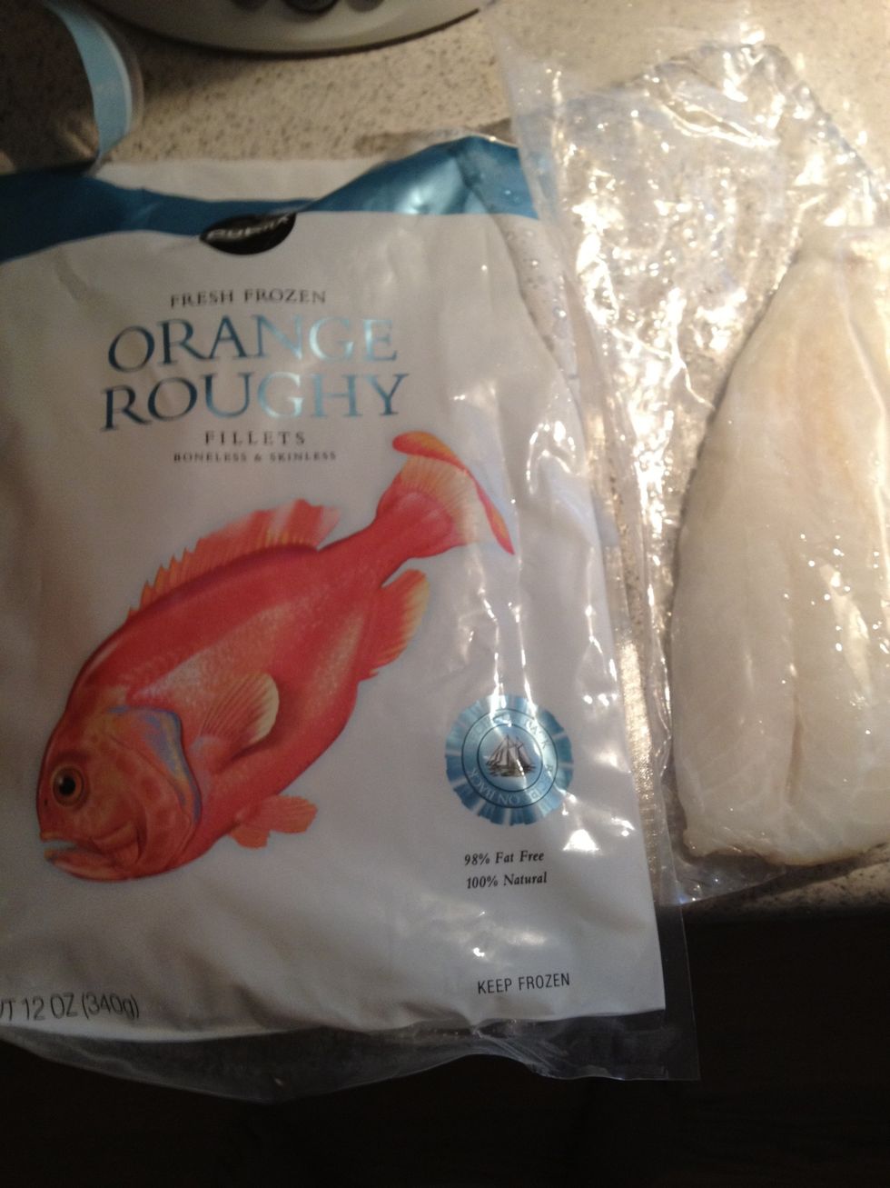 I like the store brand frozen Orange Roughy filets. (Around $8 for two filets!) Run cool water over the plastic packaging for a couple of minutes while you prep the asparagus.