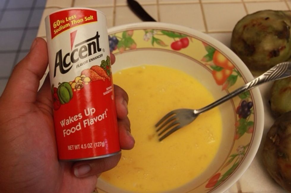 I like to add accent flavor enhancer to my mixed eggs but you can use the traditional salt and pepper or whatever you like.