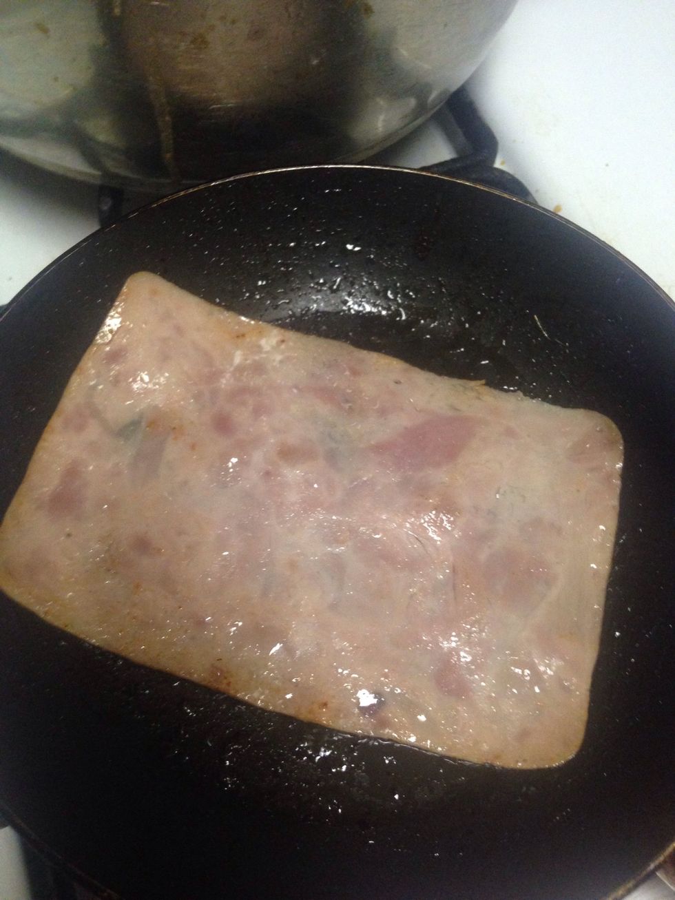 I like to add ham to my enfrijoladas but you don't have to add any or you can add chicken or beef but I just put it in the oil pan for a bit