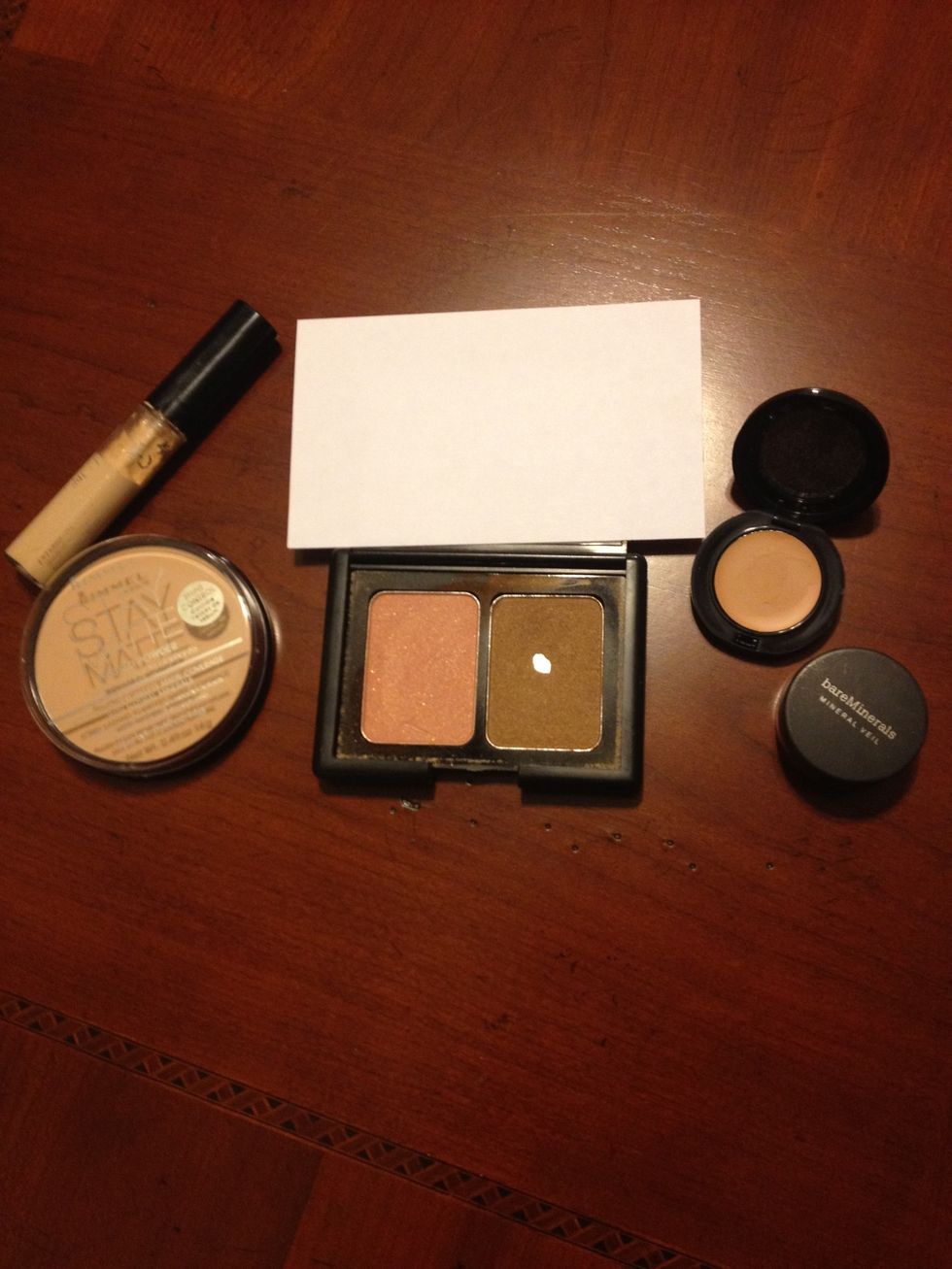 I like to bring pressed powder, liquid concealer, foundation faker, mineral veil, and a blusher/bronzer duo to add color to my face without seeming "cakey".