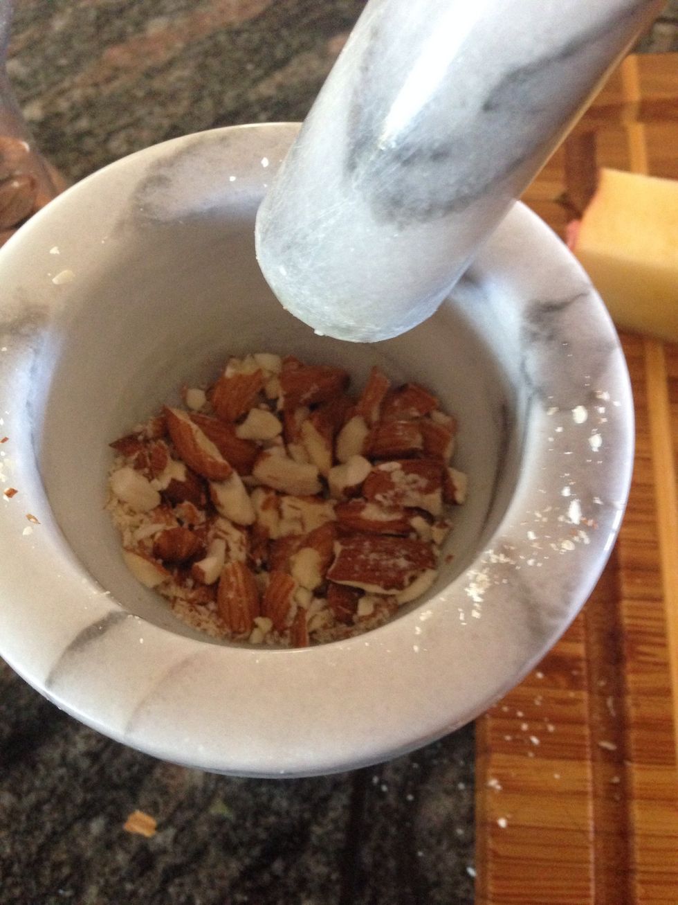 I like to chop up some of the almonds for a difference in texture. I would recommend using a food processor for this, but since I don't have one, I grind them