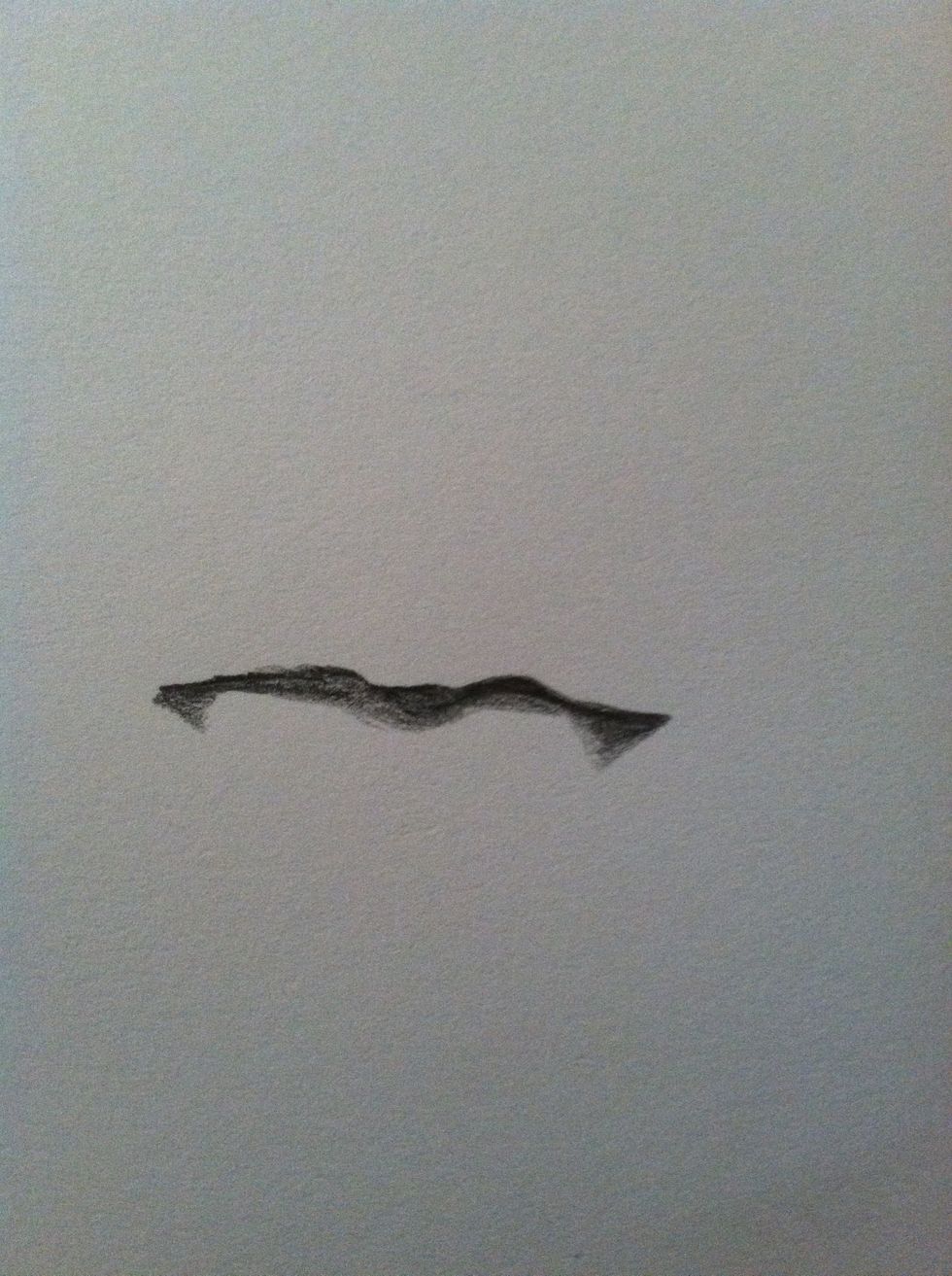 I like to continue by shading in the shadow projected on the bottom lip by the upper lip since these are some of the darkest values.