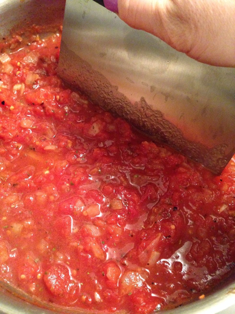 I like to cut down the tomato chunks for a smoother sauce. This dough cutter is the perfect fast short cut & less clean up than putting it through a food processor or blender.