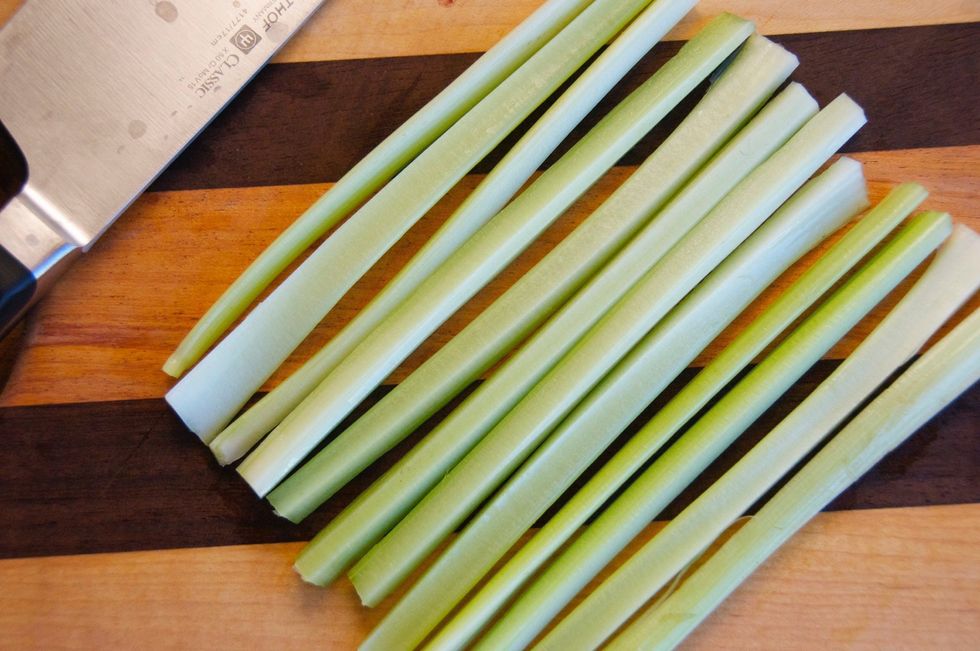 I like to cut the other ingredients to be the same size as the peas.  It just makes every bite better. Trim the ends off the celery then cut in half lengthwise, then cut each half in half lengthwise.