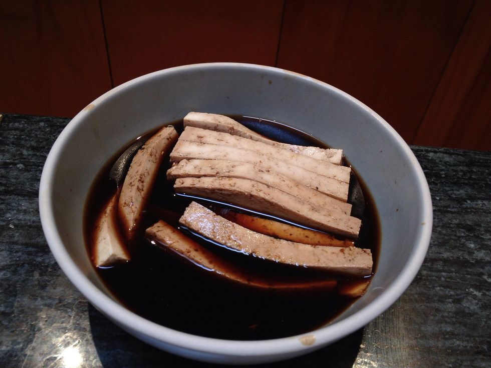 I like to cut up strips of tofu and marinate it in a bowl of soy sauce cut with water. Then I add some ginger and garlic. After 10-15 minutes it's ready to be added to the sushi roll.