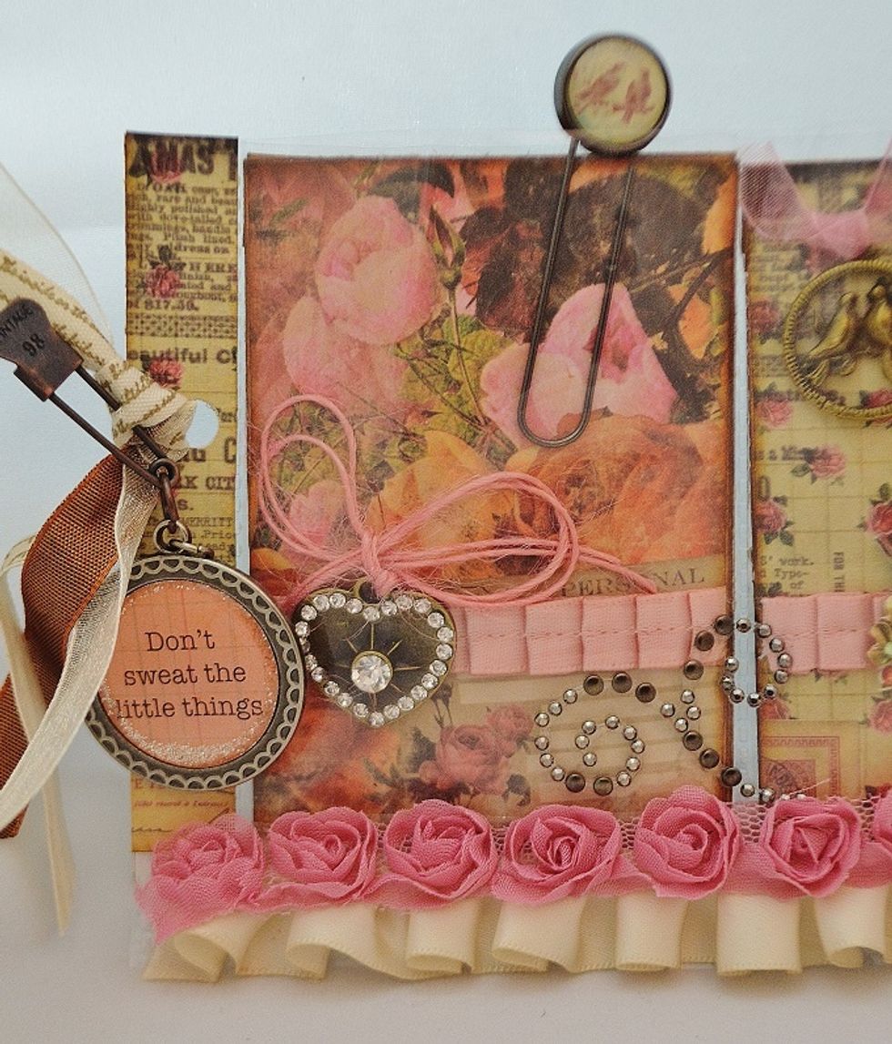 I like to decorate the spine of my pl's. I measured and cut two strips of patterned paper to size. Inked the edges & adhered with double stick tape. Be sure to punch your hole then add the back strip.