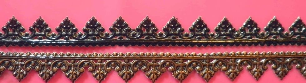 I like to finish my edges, so I applied antique gold Gilder's Paste to four strips of black German Scrap and adhered the strips around along the canvas' edge.