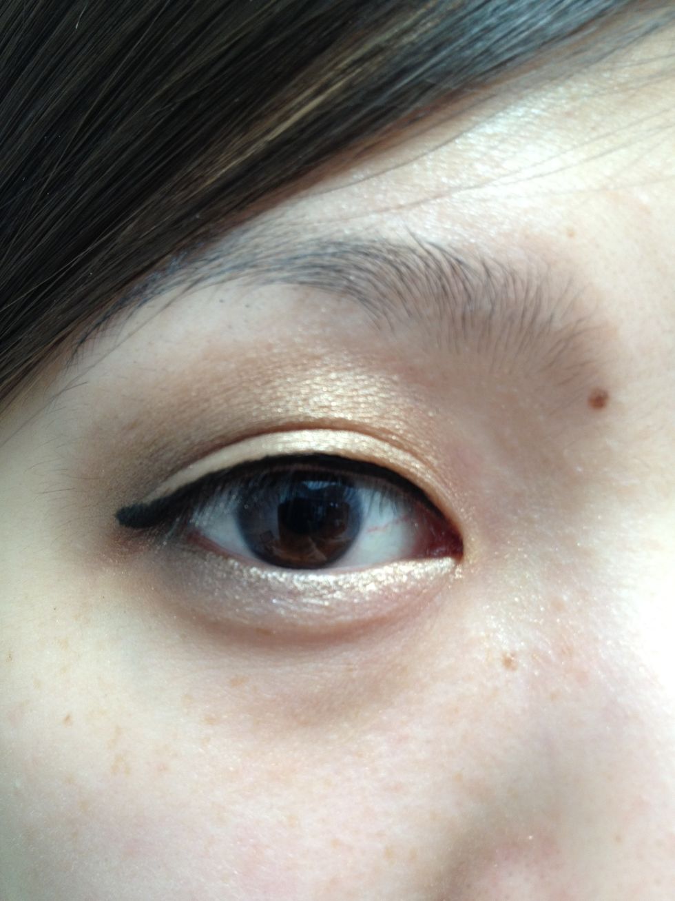 I like to go beyond the eye with the eyeliner to create a small wing to elongate your eye.