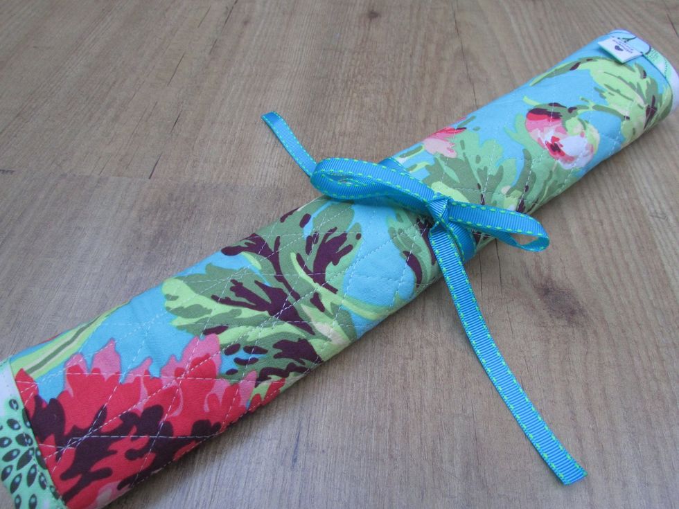 I like to keep my long knitting needles together, and this handmade quilted case does the job nicely.