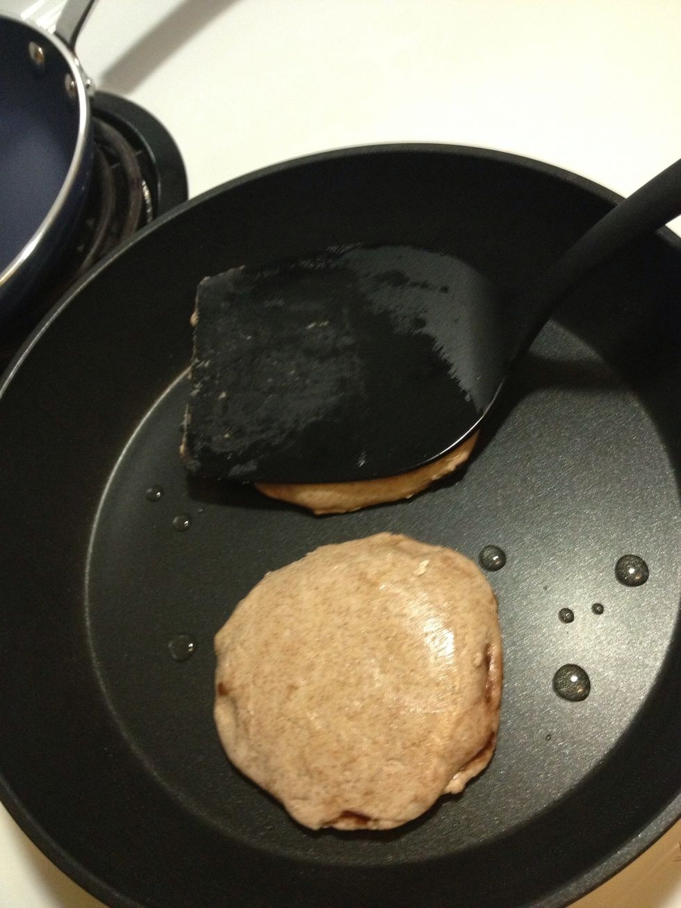 I like to press them down with the back of my spatula so they get flatter and larger.