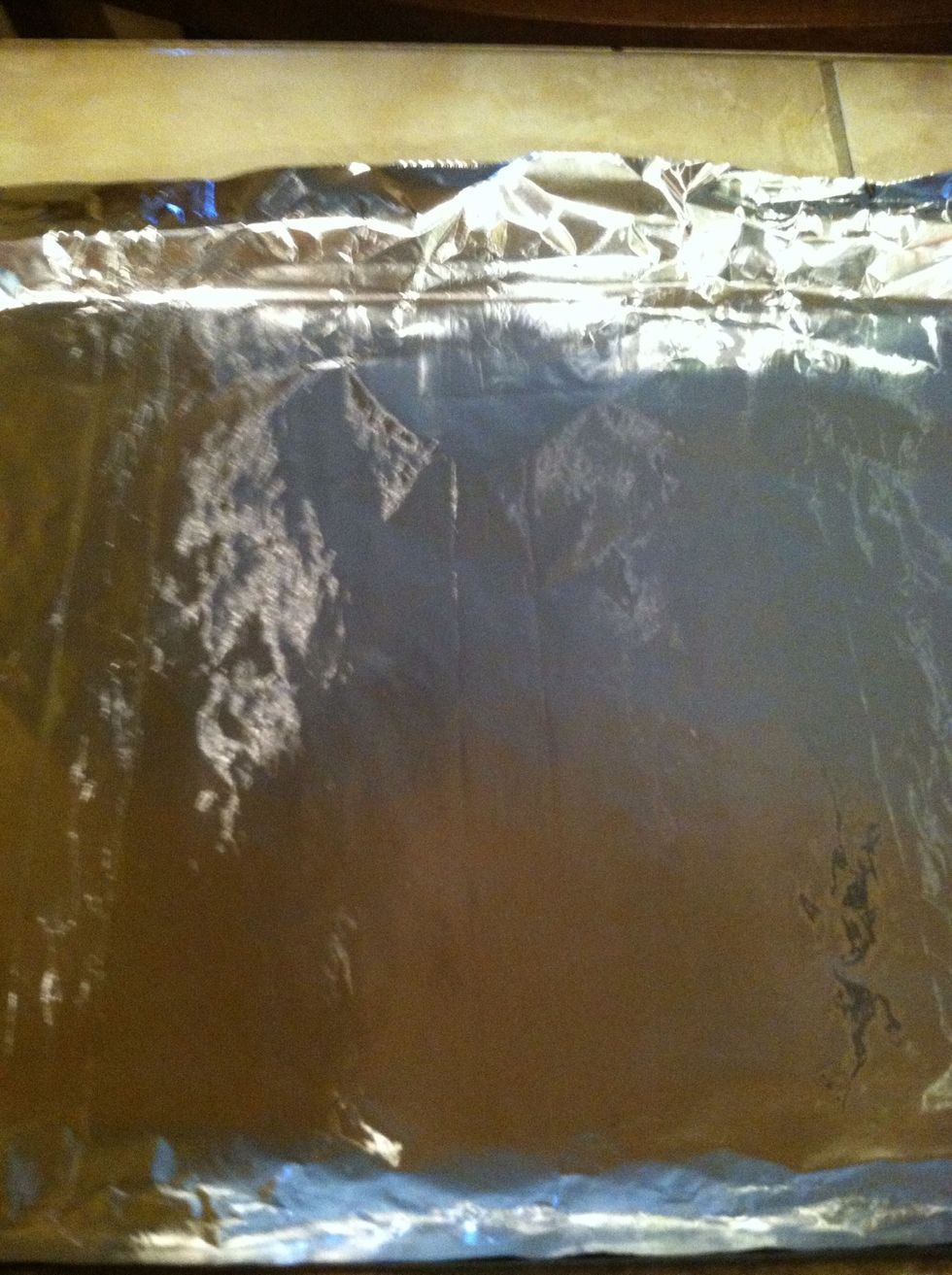 I like to put aluminum foil on a cookie sheet to put my breaded chicken in  while i bread the rest ones. but you can use whatever you like