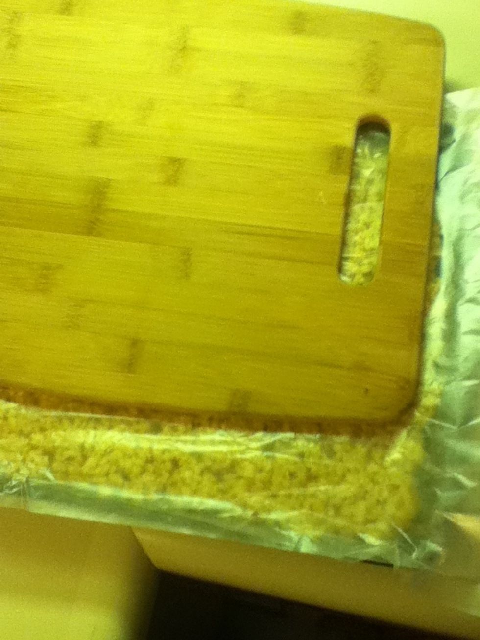 I like to put another sheet of wax paper over top and pat it down with another sheet or cutting board to make sure they have a flat top.