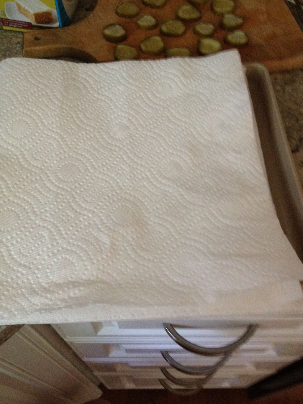 I like to put mine on a paper towel to absorb the extra grease