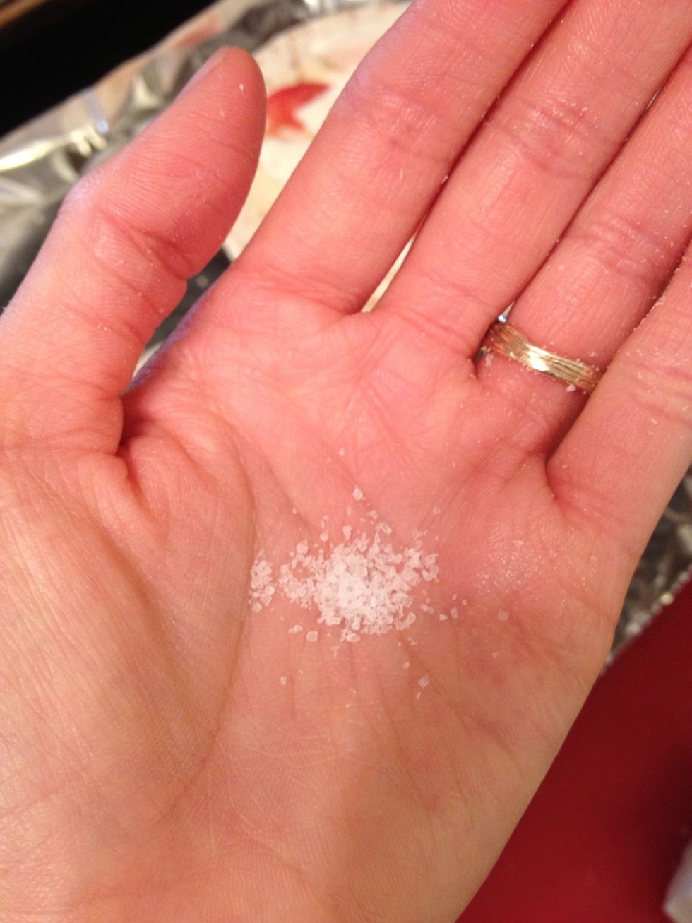 I like to put some sea salt in the palm of one hand and with the other hand, just LIGHtLY sprinkle a few grains over the tomato. This step is optional. Do NOT over salt your tomato.