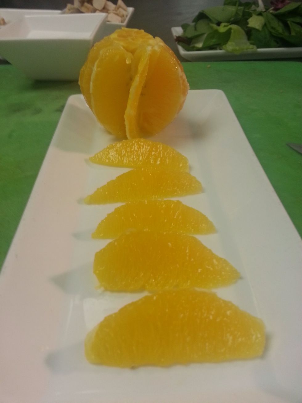 I like to take out the segments so you cut in v shapes into the oranges. I like this because it just looks nice