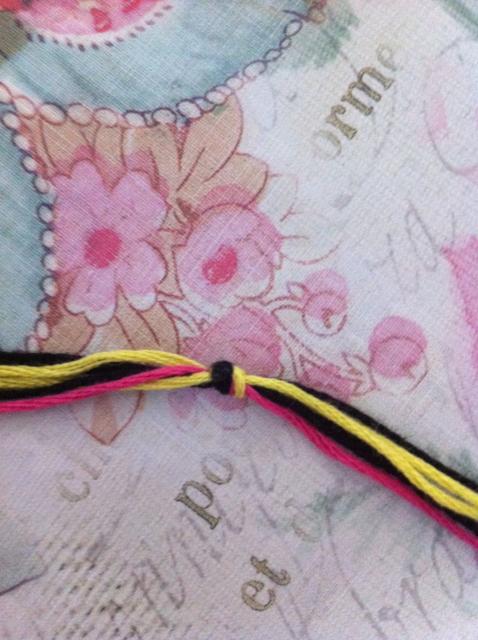 I like to tie a knot at the halfway point (where they fold in half).