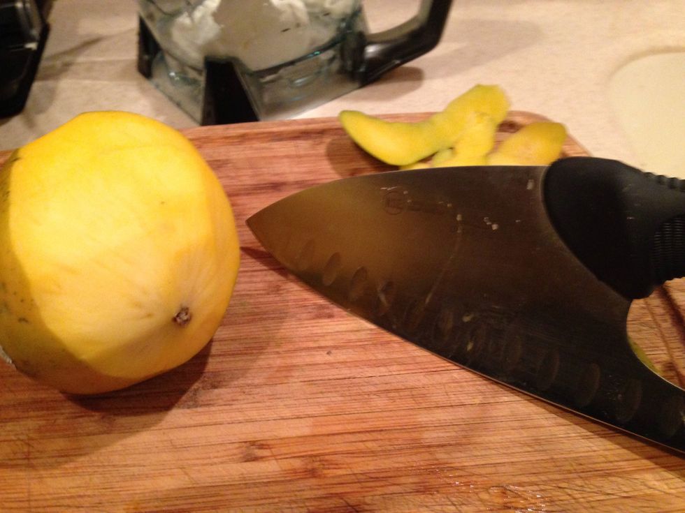 I like to use a knife to peel the mango. As a lover of large knives I am using one but a pearing knife is great as well.