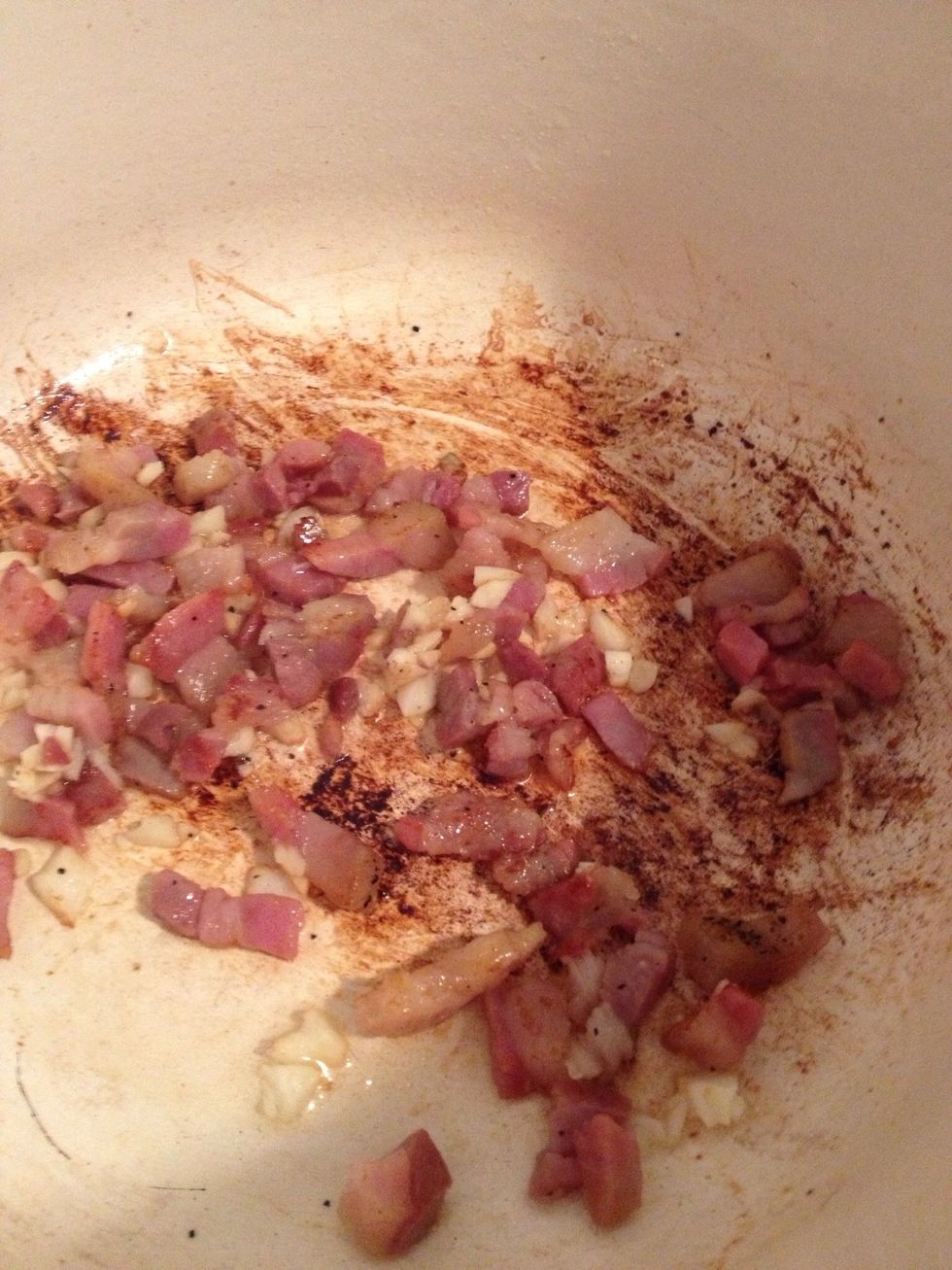 I like to use my dutch oven pot because it does really well on the stovetop and in the oven. A cast iron pot works nicely too. Saut\u00e9 pancetta in olive oil. Add garlic once pancetta is sizzling.