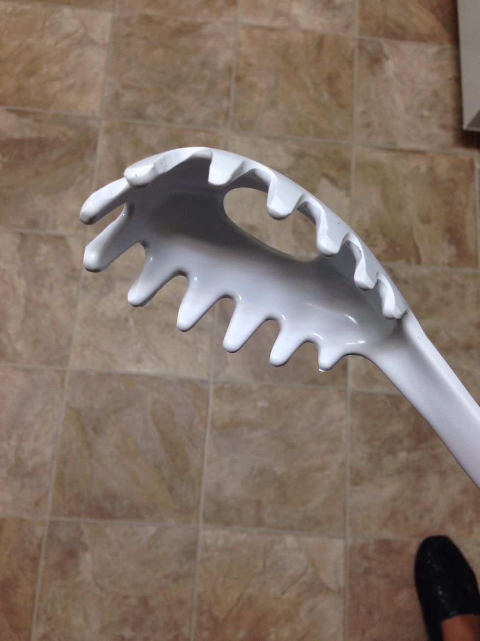 I like to use this kind of spoon to get my spaghetti out. I hate straining pasta because I'm scared I will burn myself.