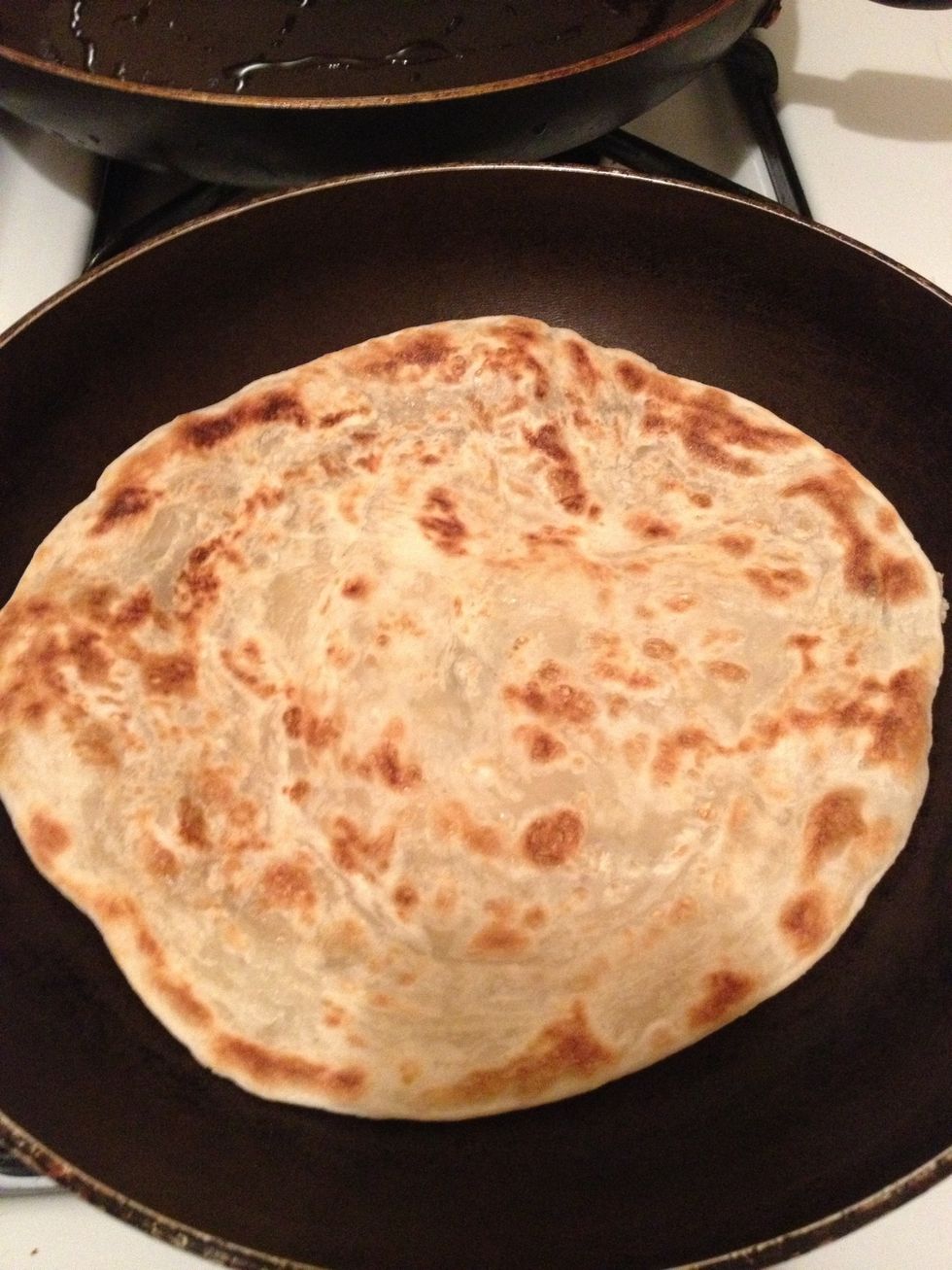 I love cooking things from scratch ... But this is cheating , frozen parathas from Indian store being cooked on non stick pan without oil, this will be served with the egg curry dip!