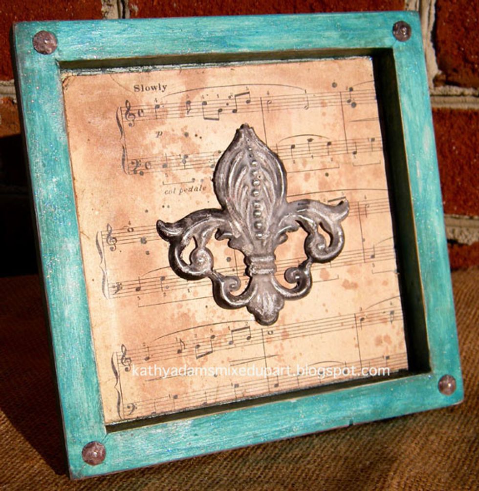 I love how the aged music paper complements the patina of the Appliques.