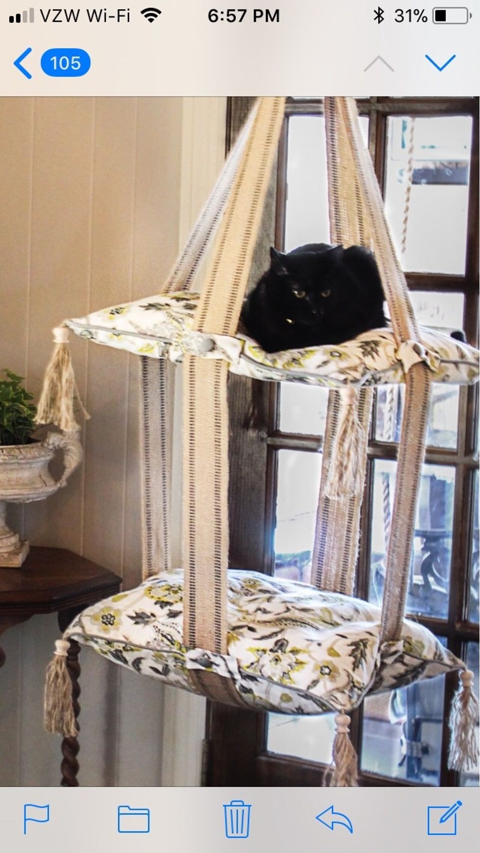 I love Pinterest for inspiration.  Here's my version of what I found.  Yoda's very own Cat Bed Swing and he loves it.  Here are the instructions of how I did it.