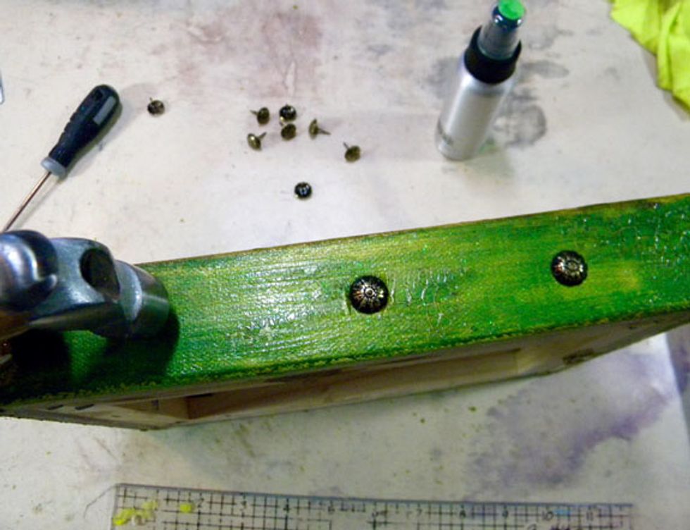 I love to add upholstery tacks to the sides of my canvases and this canvas is perfect for this look. Find them at the hardware section of Lowes or even Walmart. Also, see the cracks on the sides?