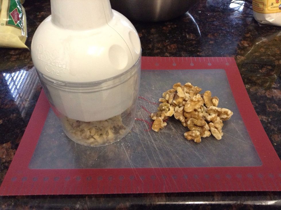 I love to chop my nuts using my food chopper, but you could use a large chef knife on cutting board and roughly chop.