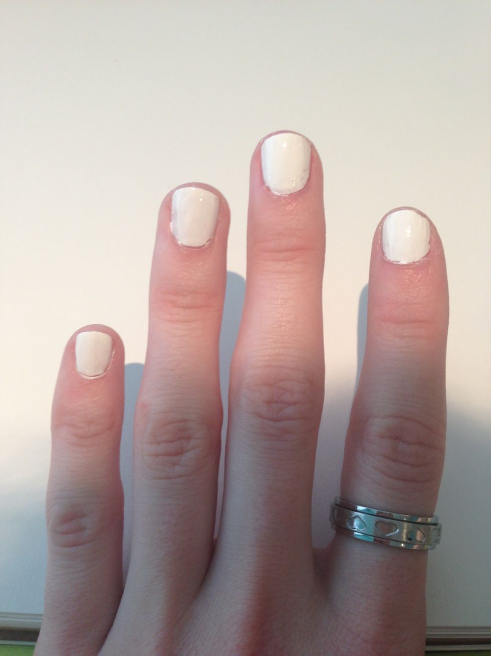 I love using neons in summer. Since my base coat in neon orange I am putting a base of white on my nails to make my neon polish brighter and cover in less coats! I used sinful colors snow me white