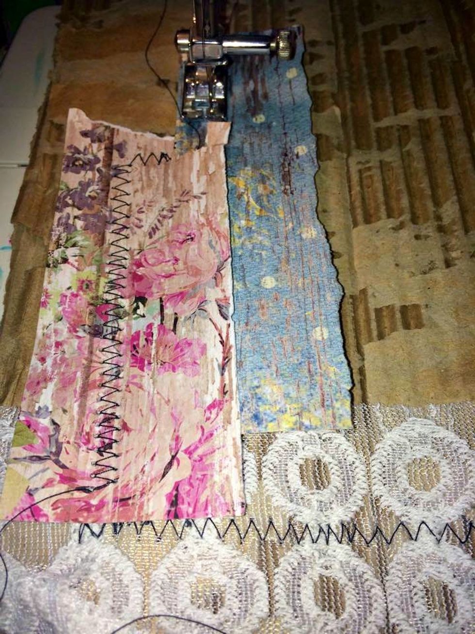 I love using the zig zag stitch setting on my machine, and I almost always use black thread. Here are some of the paper and lace being sewn onto the corrugated cardboard, overlapping to create layers