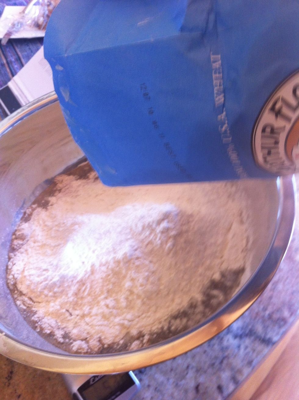 I'm adding the white flour directly in the bowl, checking scale as I do. No measuring cups.