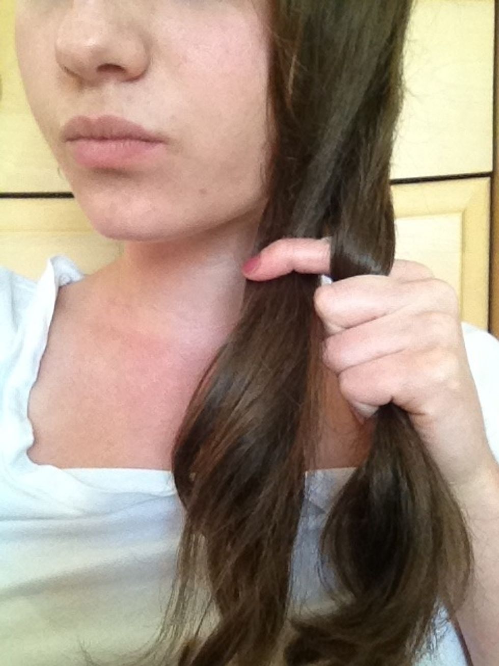 I'm going to show you guys how to do fishtail pigtails. Fishtails of any kind are easy to do once you get the hang of it. Separate your hair into two sections. Pick a section and separate that as well