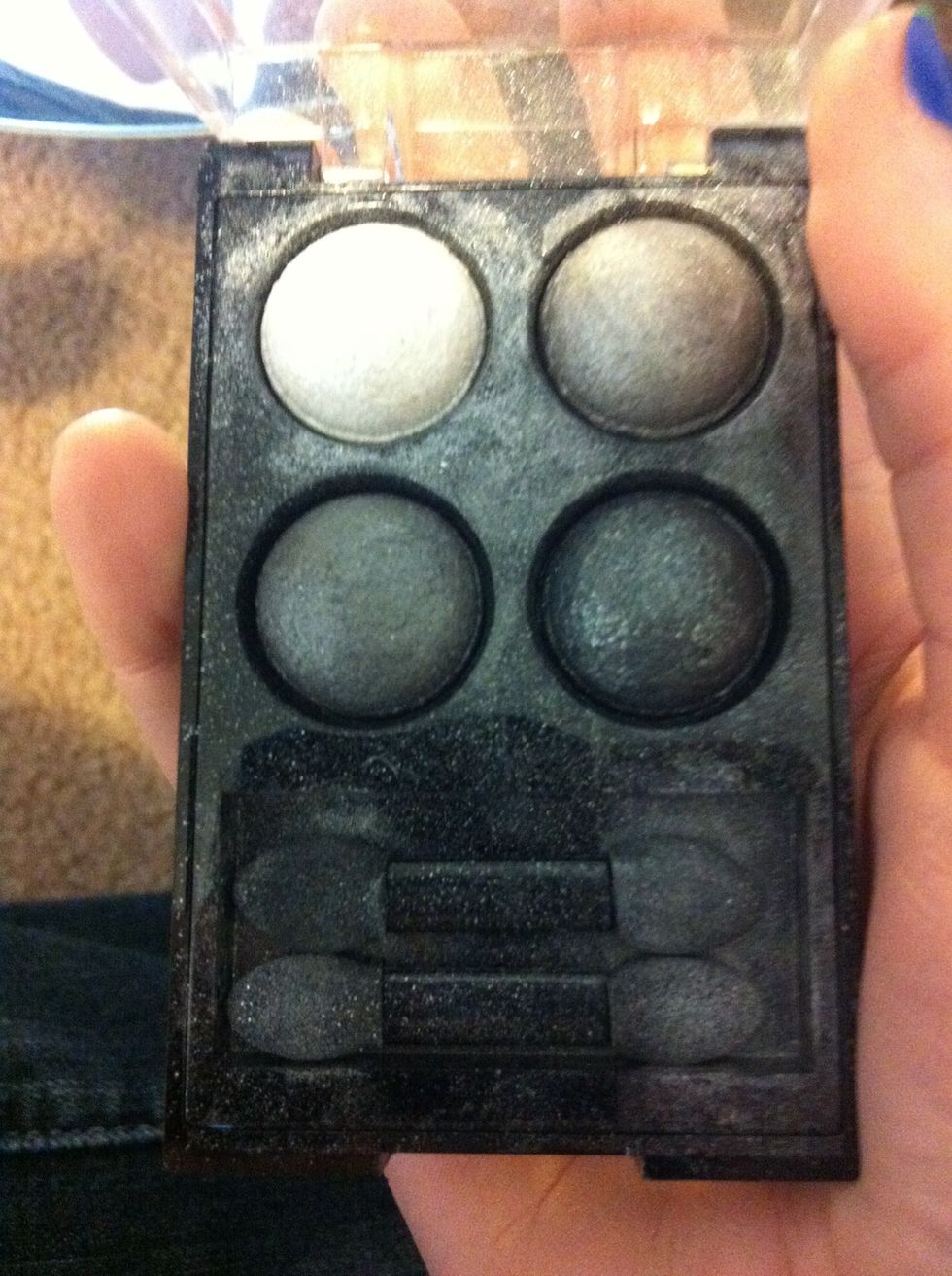 I'm going to start with the white as my base eyeshadow.