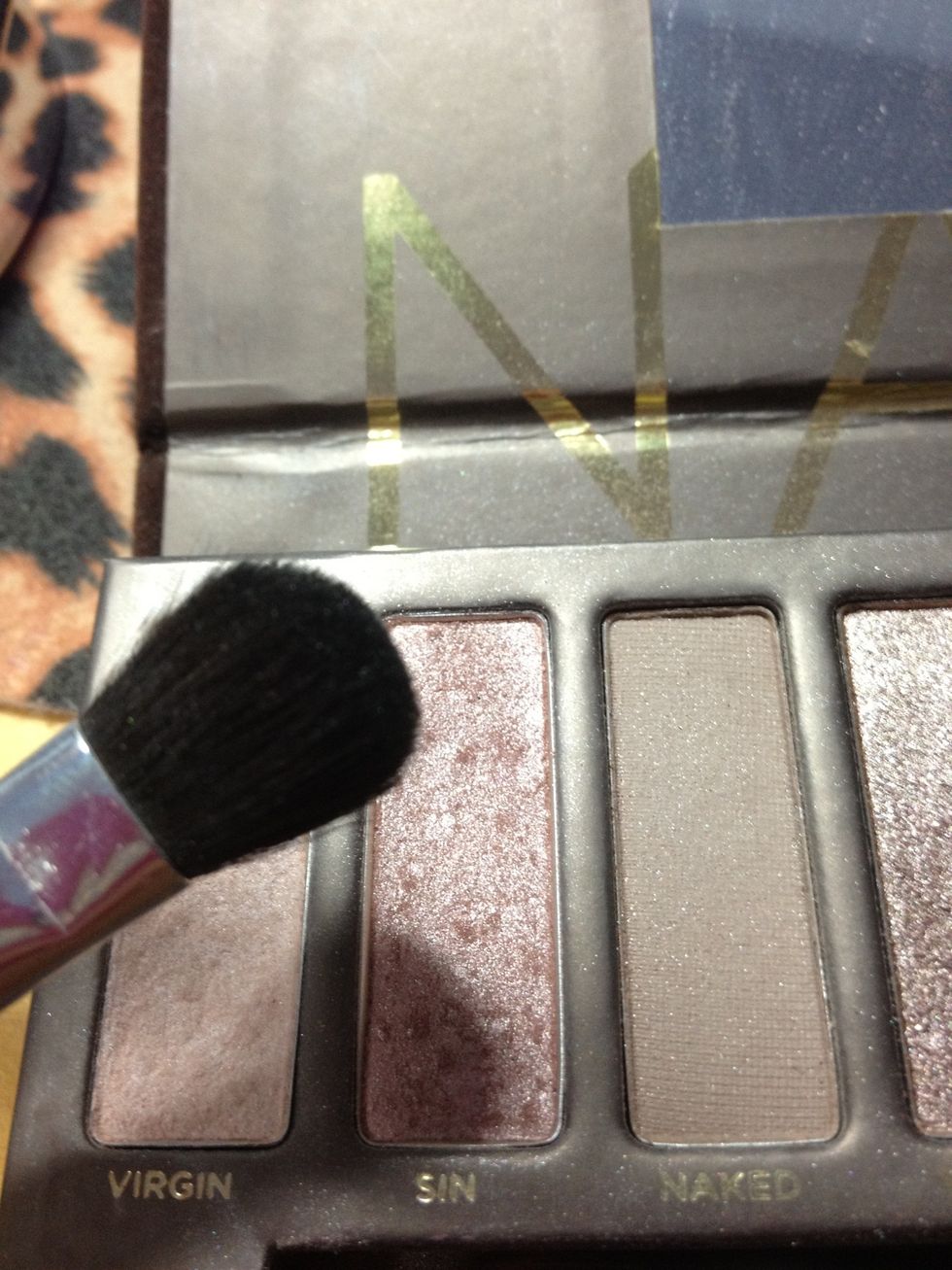 I'm going to use this fluffy brush and the color "Sin" (second from the left) on my whole lid