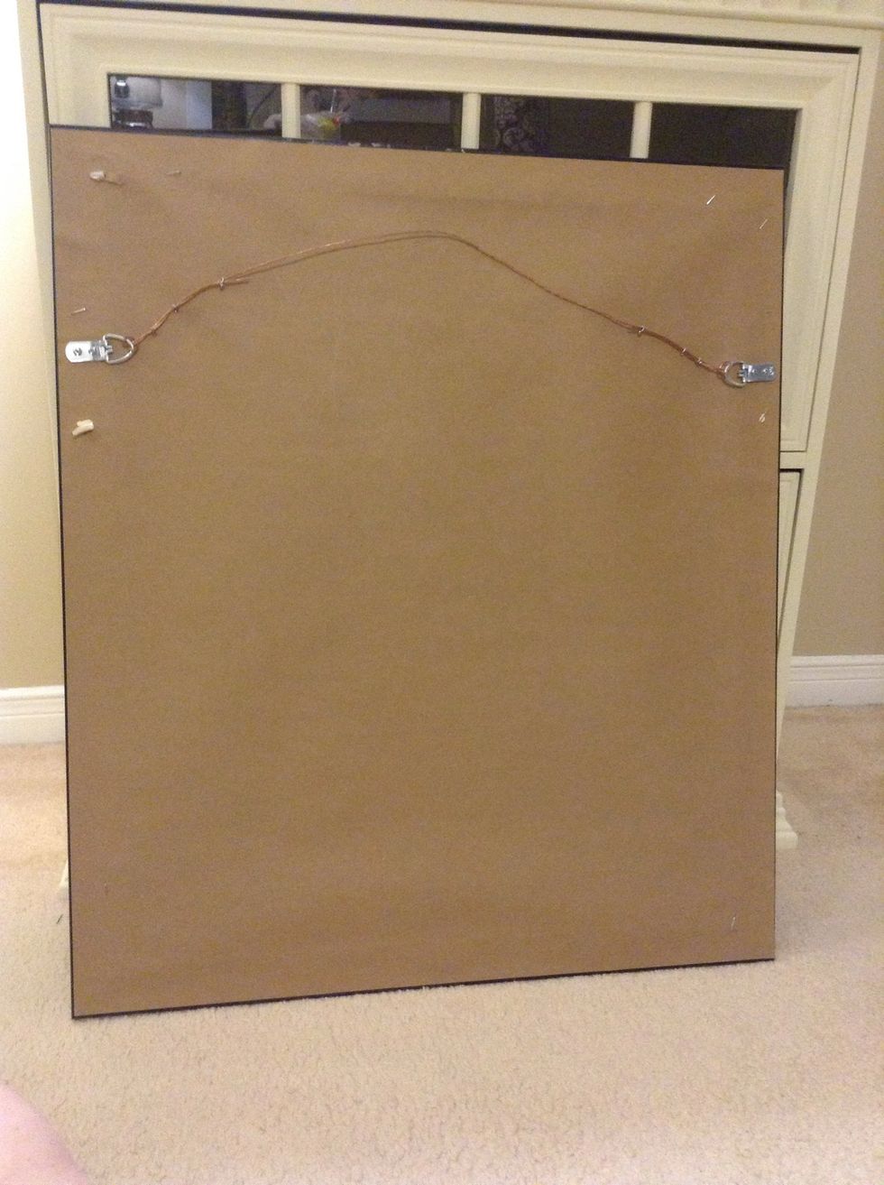 I'm hanging my art from the D-Ring style brackets on the back. Hanging anything on a wire, will eventually warp the frame away from the wall, especially in humid climates. I strongly discourage wires.