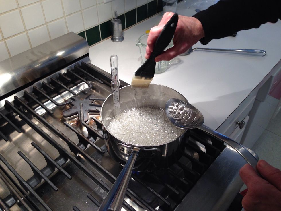 I'm showing you this because pros always tell you to wash down the crystals that form on the sides with a wet brush. But, there are no crystals! This is boiling plastic. Now, if it were sugar...