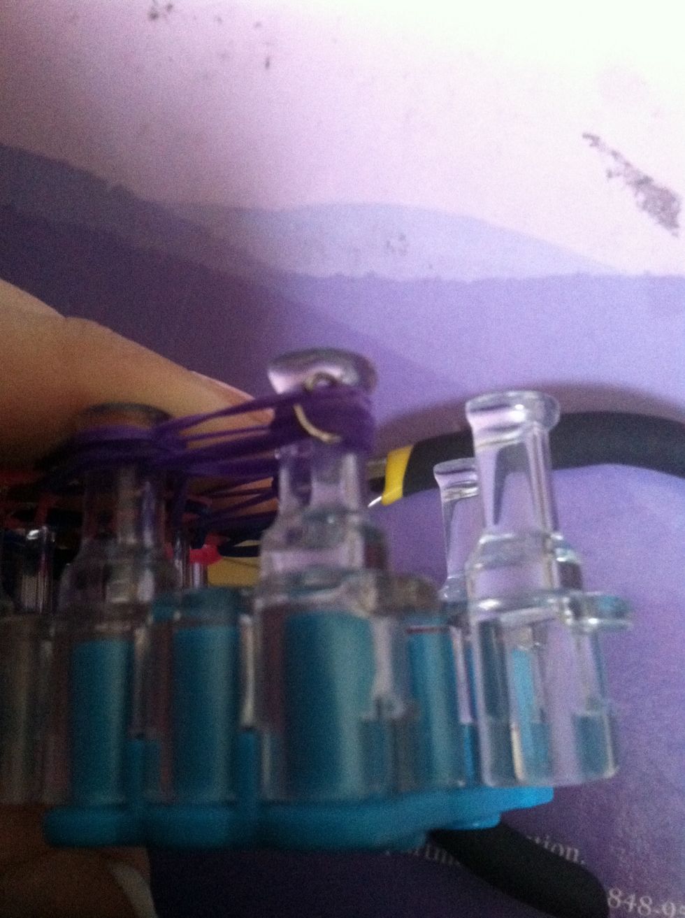 I'm using a metal "c" clip, you can use plastic either works.  Make sure you get ALL the rubber bands that are on the first peg in the clip. Or else...  It'll just fall apart . ):
