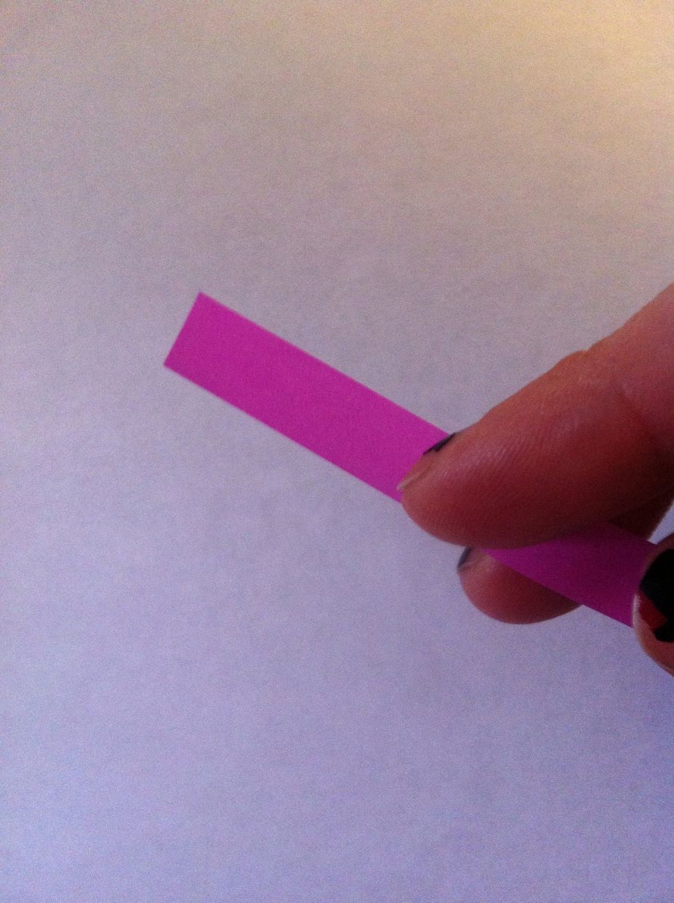 I'm using a paper strip that's used for lucky stars. I end up using two, so my strip is approx 30 cm long & not quite 1 cm wide. If you have paper like mine, hold 2 back to back for solid color rose.
