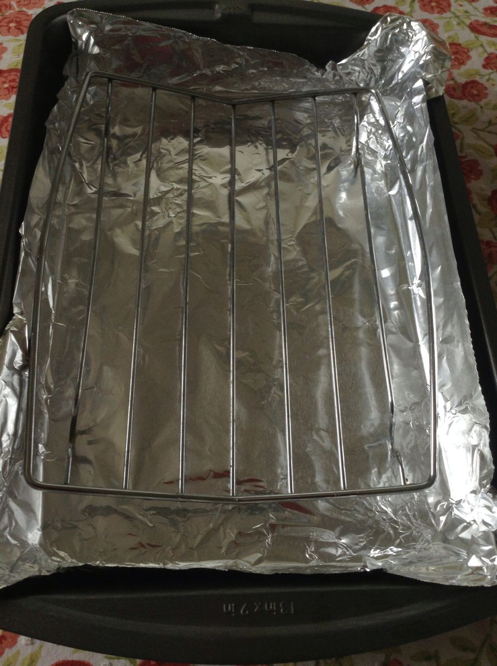 I'm using a rack so that the skin of the chicken cooks evenly all around. But you can also place the chicken directly on the foil.