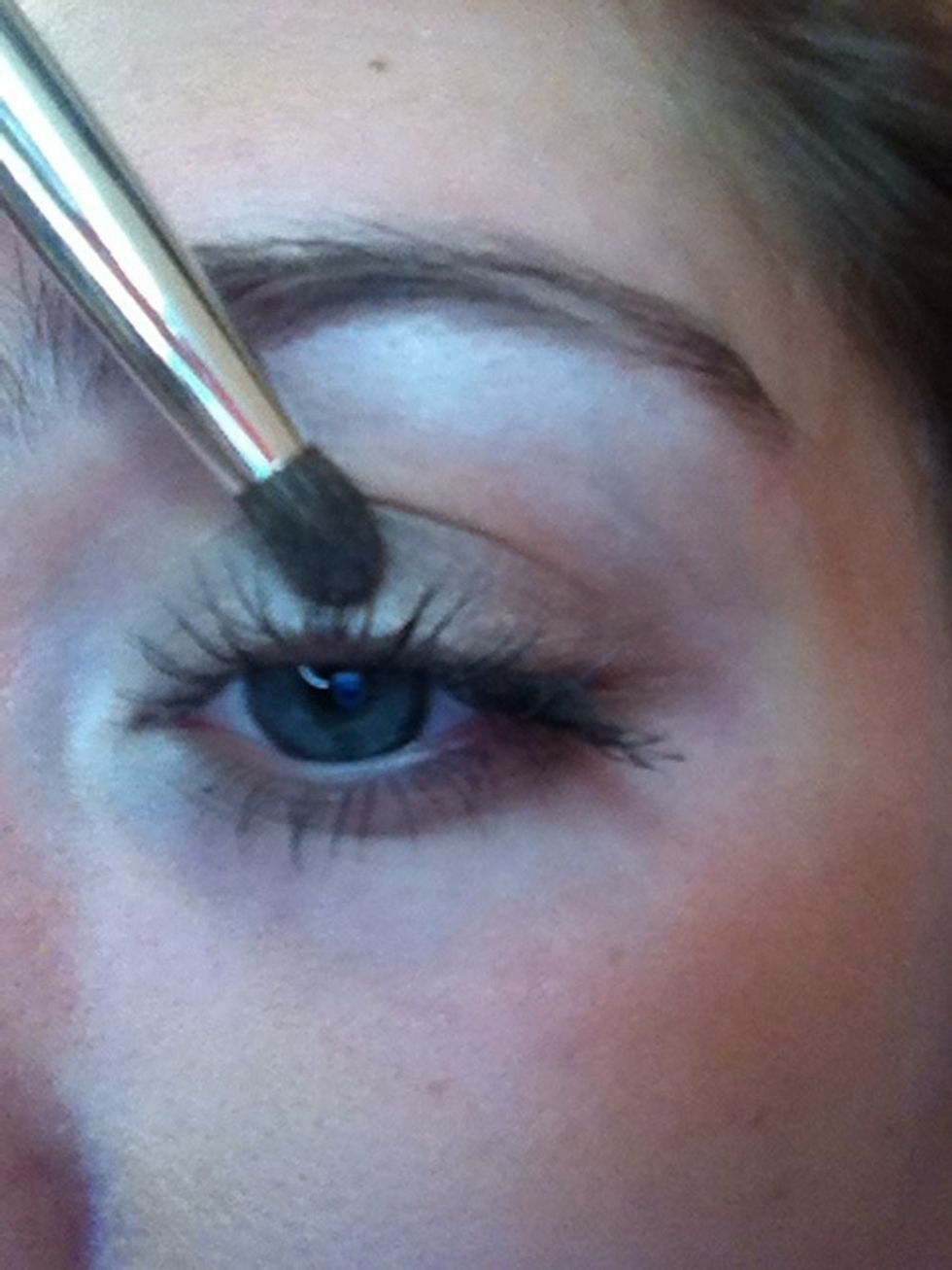 I'm using a shadow brush and blending the eyeshadow line upwards blending it with the rest of the eyeshadow.